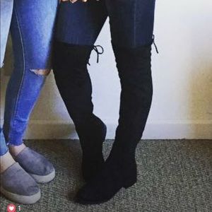 Tall black boots with ties